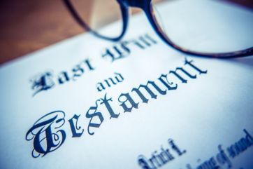 Retro Styled Detail Of A Last Will And Testament Document With Glasses